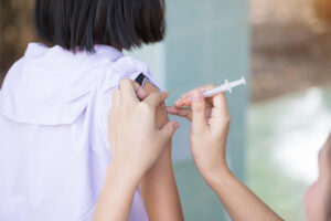 Teenage girl getting HPV vaccination