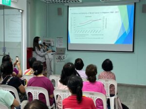 Dr Lynette Ngo talks about breast cancer incidence and mortality to audience