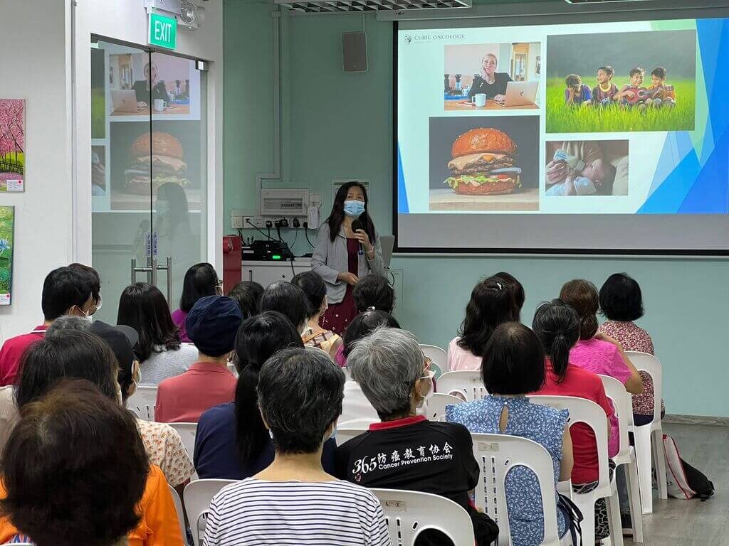 Dr Lynette Ngo talks about diet and lifestyle contributing to breast cancer to audience